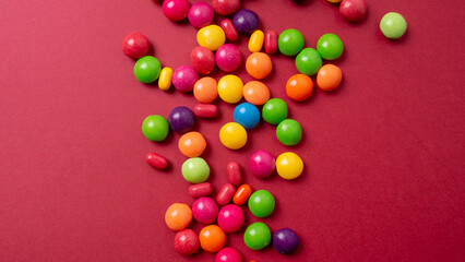 colorful little candies on a colored background