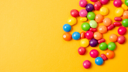 colorful little candies on a colored background