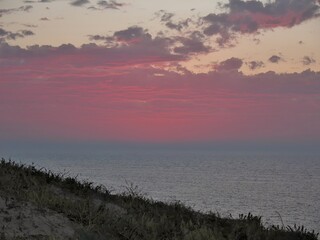 Beach sunset with darkness approaching, displaying very subdued colours.
