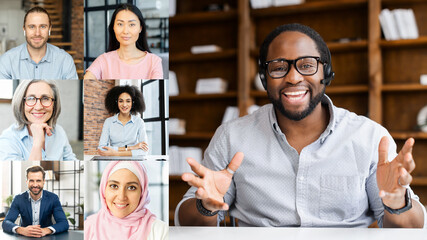 Online job interview concept. Video call screen with a smiling African-American job applicant introducing himself, diverse hr representatives listening. Video conference of multi ethnic employees