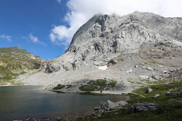 Fototapeta na wymiar mountain panorama with the small Alpine lake called VOLAIA in th