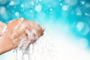 Human washing hands in clean water