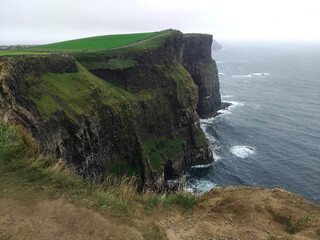 View of the Cliffs of Moher in summer. Cliff in Ireland, on the Atlantic Ocean in County Clare.