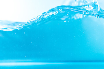 Water wave with bubble of air, on white background. Blue water