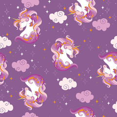 Seamless pattern with heads of unicorns and clouds