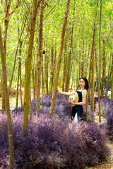 Woman walk in Fantasy Flower Dream Field with beautiful color