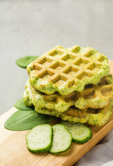 Spinach waffles on wooden board. Helthy vegetarian cuisine. Homemade food