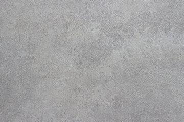 The texture of the floor tiles with a light pattern that mimics a marble slab.