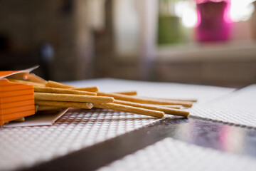 Fototapeta premium long crispy straws on the kitchen table