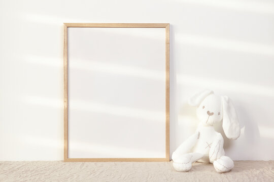 Nursery photo frame mockup with white bunny