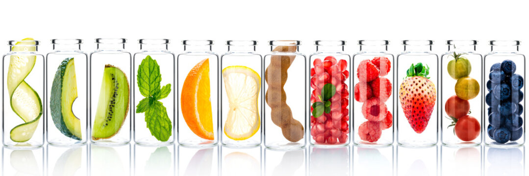 Homemade Skin Care With Fruits Ingredients Avocado ,orange ,blueberry ,pomegranate ,kiwi ,lemon Slice ,cucumber ,tamarind ,strawberry And Raspberry In Glass Bottles Isolated On White Background.