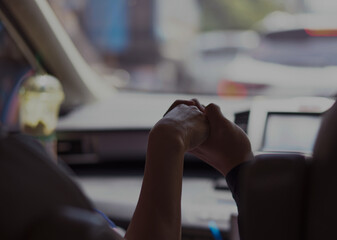 hands of woman and man hold inside car