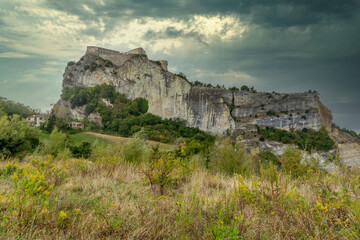Fototapeta na wymiar The imposing fortress of San Leo, Emilia Romagna, Italy, under a dramatic sky