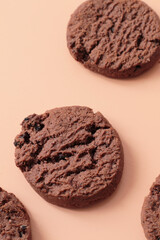sweet brown chocolate chip cookies on peach pink background
