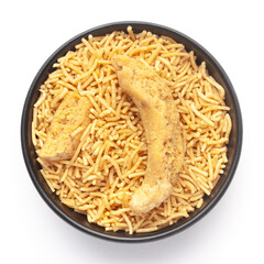 Close-Up of Indian spicy snacks (Namkeen) - Bikaneri Besan Bhujia in a black Ceramic bowl, made...