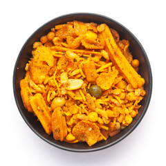 Close up of Teekha Meetha crunchy spicy Indian namkeen (snacks) on a ceramic black bowl. Top view