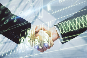 Double exposure of education theme hologram and handshake of two men.