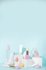 Modern Minimal Mockup Display, Make up Cosmetics on white Pedestal Stand Podiums On Blue Background copy space