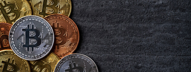 Top view business concept of bitcoin cryptocurrency on dark slate table background.