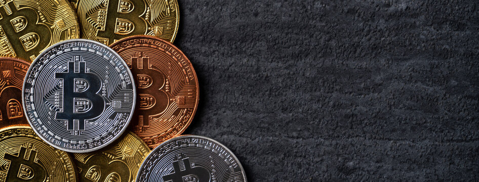 Top view business concept of bitcoin cryptocurrency on dark slate table background.