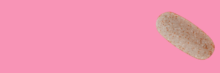 multivitamin tablet close up on pink background, advertising banner concept