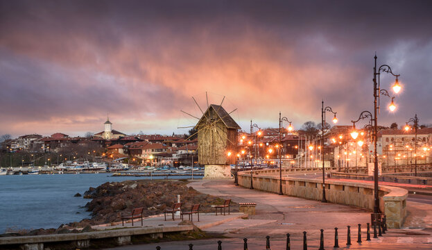 Nessebar old town in Bulgaria and old wind mill at sunset. Nesebar is one of the major seaside resorts on the Bulgarian Black Sea Coast. UNESCO heritage site