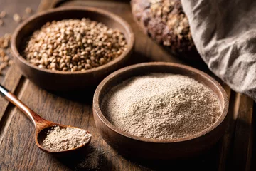 Poster buckwheat and buckwheat flour on a wooden kitchen board, gluten-free. © CHZU