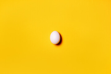 Easter. Natural healthy food and organic farming concept.Pattern from chicken eggs on yellow background. Creative food minimalistic background, 