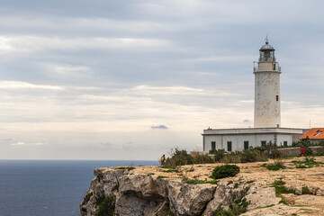 Fototapeta na wymiar Lighthouse on the coast of the island of Formentera