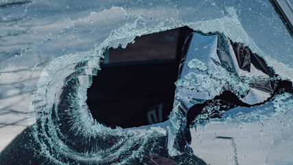 hole in a window of a car