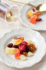 Breakfast table with morning light. Dried fruits of cranberries, raisins, papayas and mangoes.