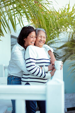 Beautiful senior filipino woman sharing some family time with her daughter