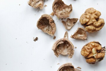 Walnut with shell on white background. Top view, flat lay 