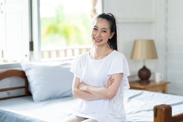 Young Asian woman feeling happy smiling. Portrait gorgeous woman at home
