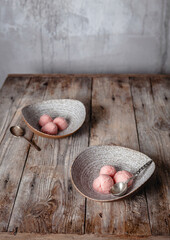 fresh orange ice cream scoops served in ceramic bowls on wooden table, copy space, seasonal dessert concept
