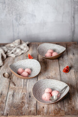 fresh orange ice cream scoops served in ceramic bowls on wooden table, copy space, seasonal dessert concept

