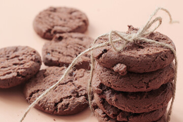 stack of tasty chocolate cookies with ribbon