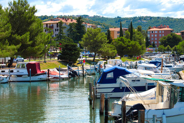 Fototapeta na wymiar Yachts, boats and ships in the marina of Portorose (Portoroz) resort on Adriatic sea in Slovenia