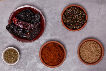 Sesame and pumpkin seeds Mexican sauce Pipian Tlatonile and ingredients. Flat lay view.