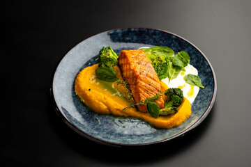 Grilled red fish fillets. Salmon with vegetable puree and spinach.