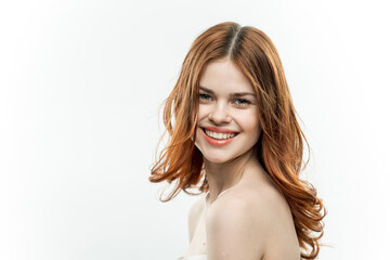 Fototapeta premium cheerful pretty woman with bare shoulders isolated background smile studio