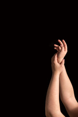 Woman hands on the black background. Treat yourself right concept. Women self-love, significance, and soul concept. Vertical image with copy space