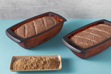 Homemade bread with acorn flour. Two loafs of freshly baked bread at home in clay natural moulds. © Fotema