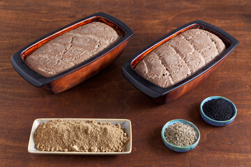 Homemade bread with acorn flour. Two loafs of freshly baked bread at home in clay natural moulds. © Fotema