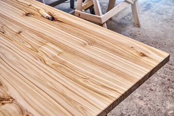 Live edge elm desk countertop in workshop close-up