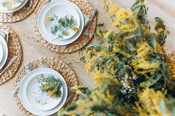 Yellow spring fresh bouquet of flowers in kitchen