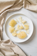 Fresh peeled pomelo, grapefruit or shaddock