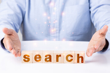 search engine opitimization wood block hand technology orange light len flare effect concept,...