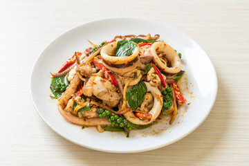 stir fried holy basil with octopus or squid and herb