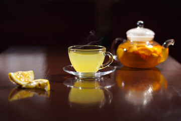 Hot drink with lemon. Hot tea with lemon. Hot cocktail with lemon.